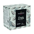 Valrhona cocoa powder packaging with cacao bean design on a light green background